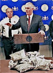 the step & repeat banner in action, behind the Attorney General during a press conference