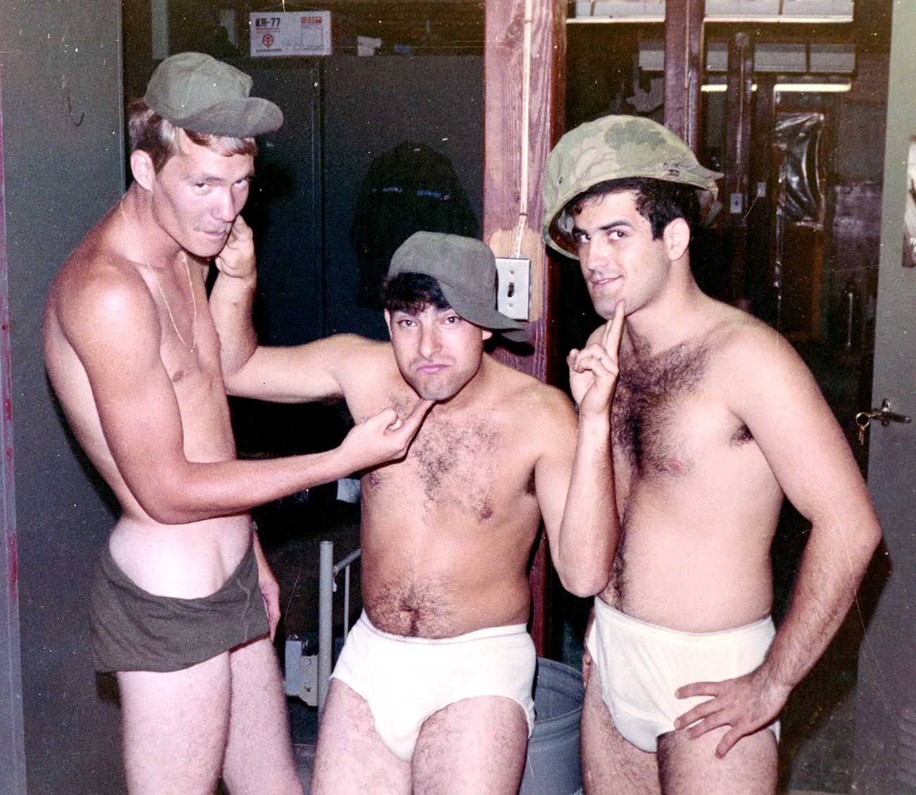 owner/founder Norman Dee in the center, posing with fellow servicemen